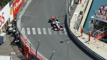 Hamilton pushes his Mclaren close to the barriers
