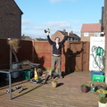 Tom celebrates fixing the hole in the decking