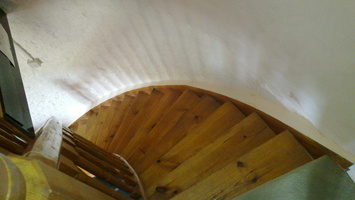 Stairs down to the lounge in the converted windpump